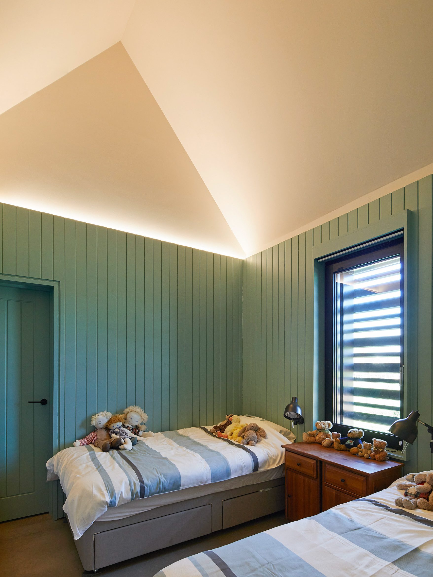 Green bedroom in Cambridgeshire house | cdc studio cambridge architects