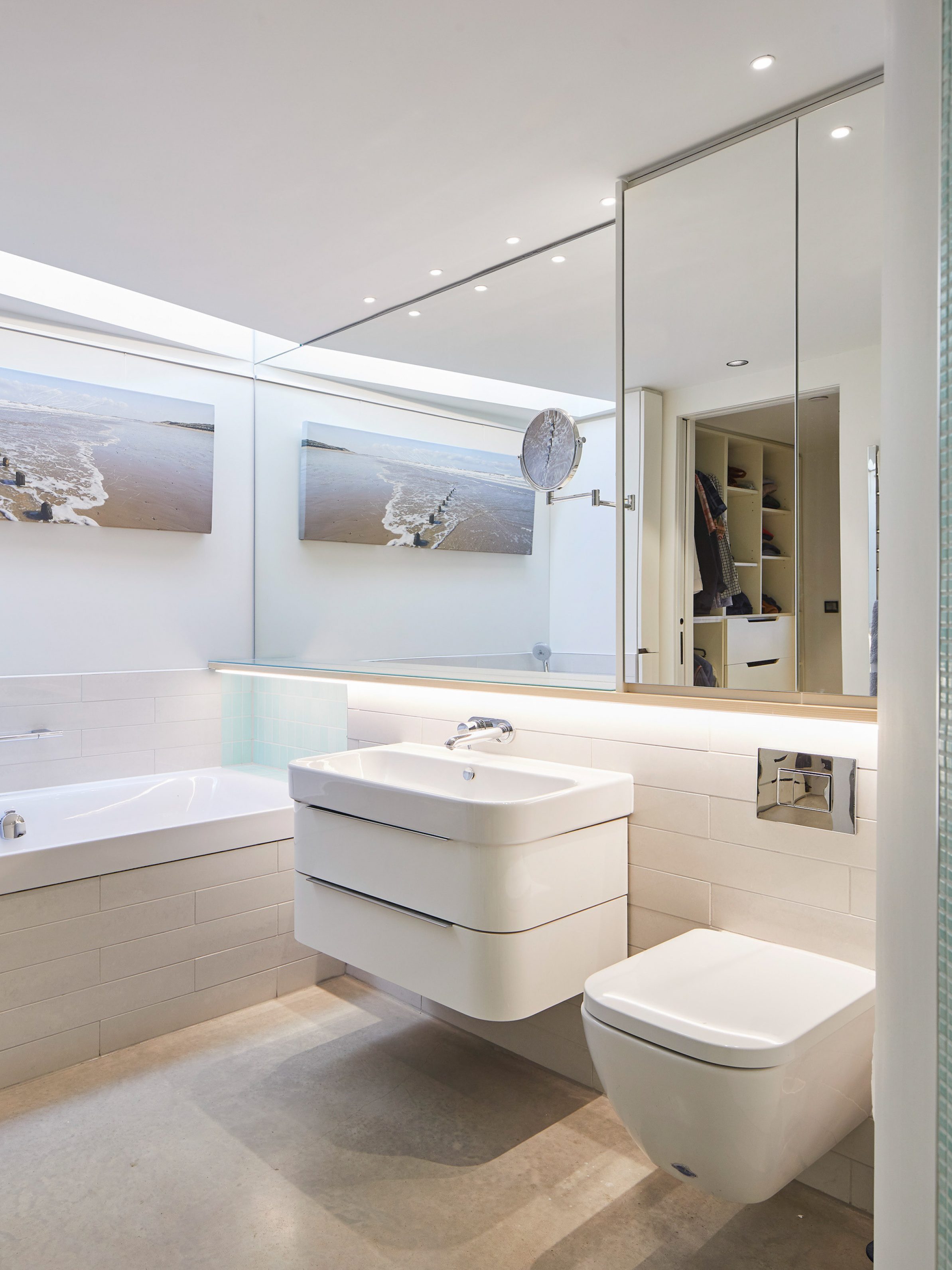 white bathroom with mirror, toilet and sink | cdc studio cambridge architects