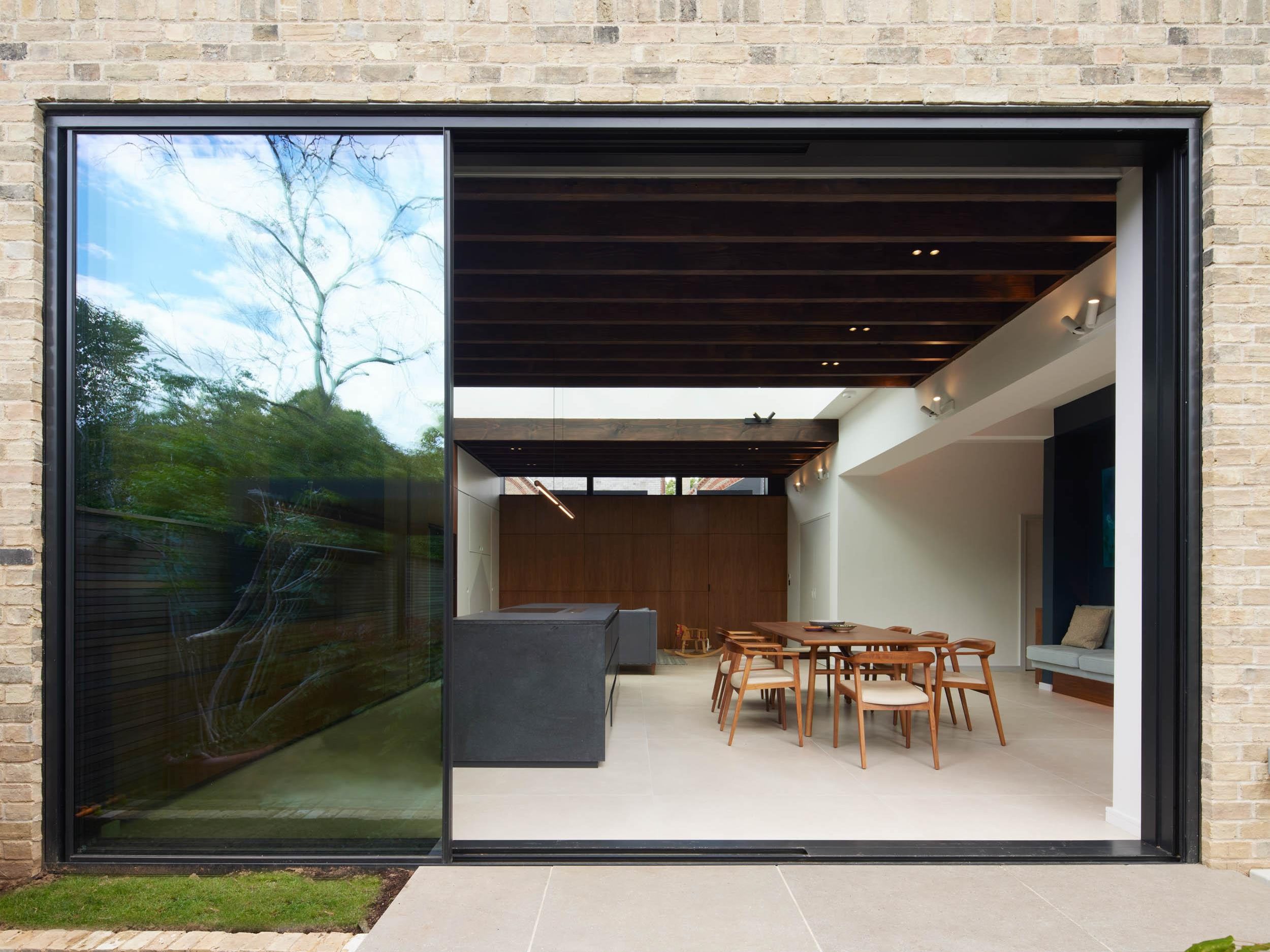 view from the garden of a contemporary kitchen and dining area | cdc studio cambridge architects