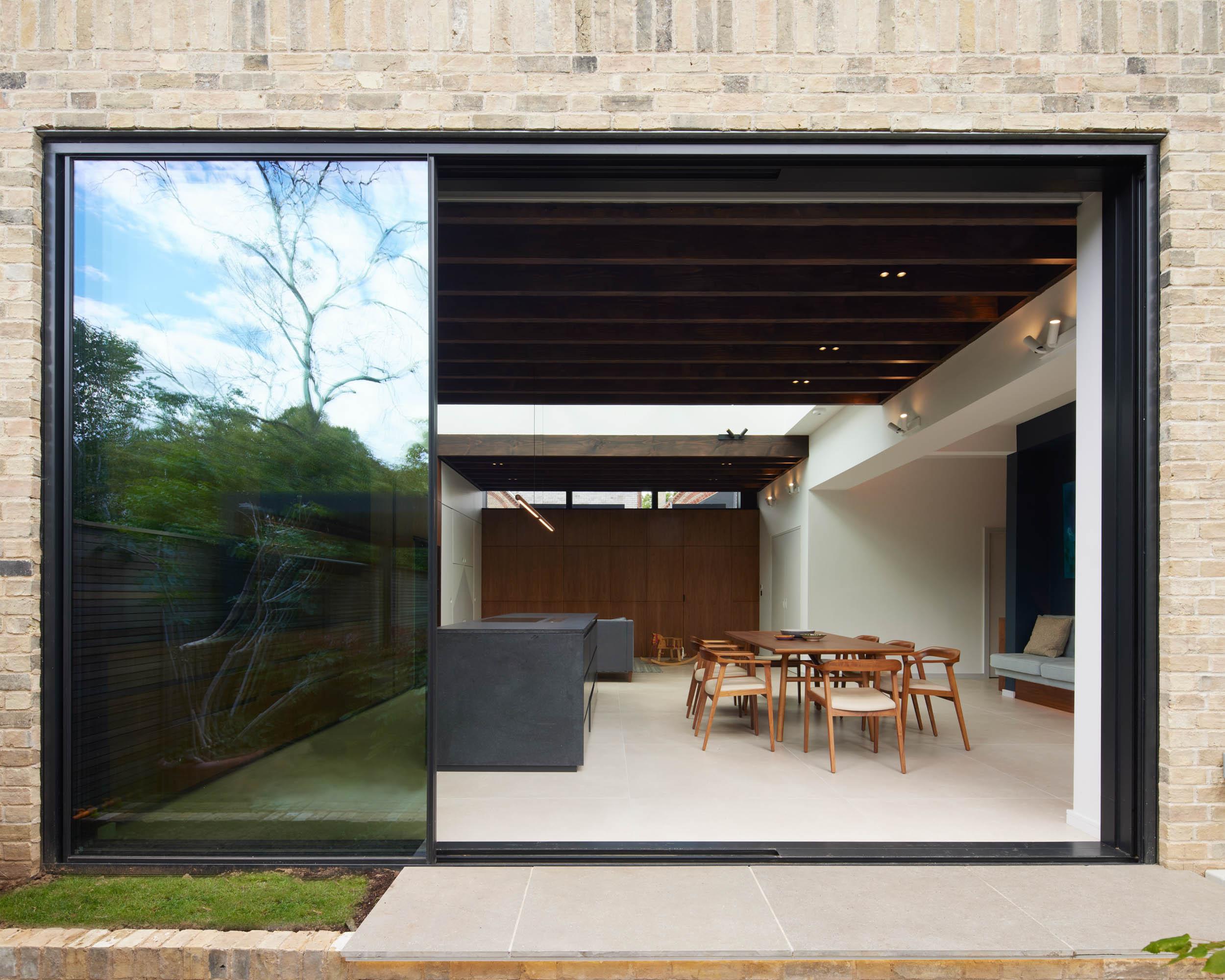 view from the garden of a contemporary kitchen and dining area | cdc studio cambridge architects