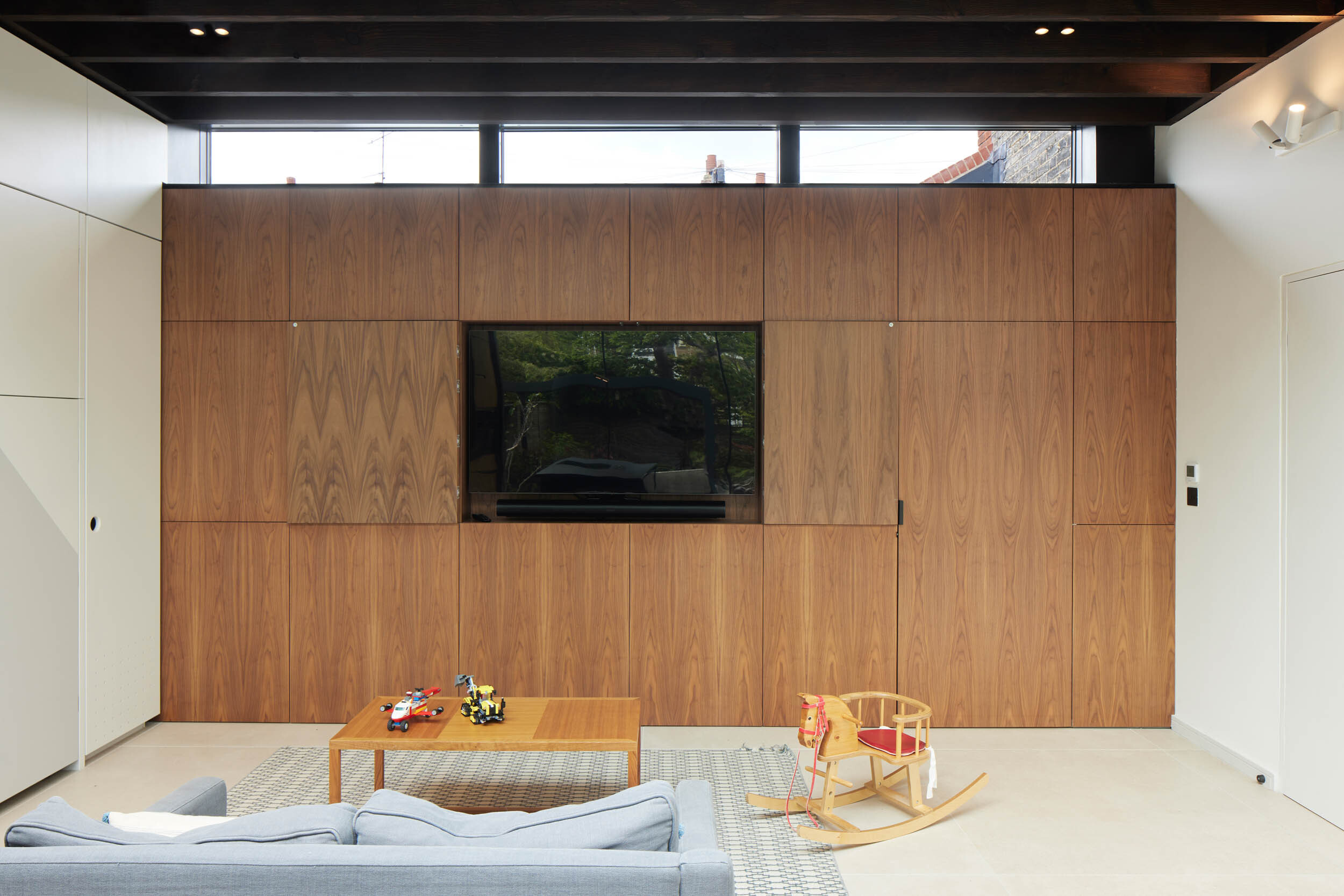 concealed tv behind walnut veneered panels 3 | cdc studio cambridge architects