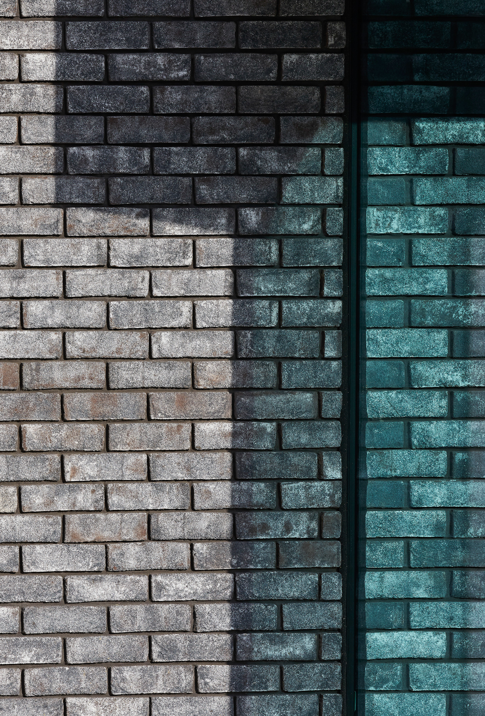 Grey brick wall of Cambridgeshire house | cdc studio cambridge architects