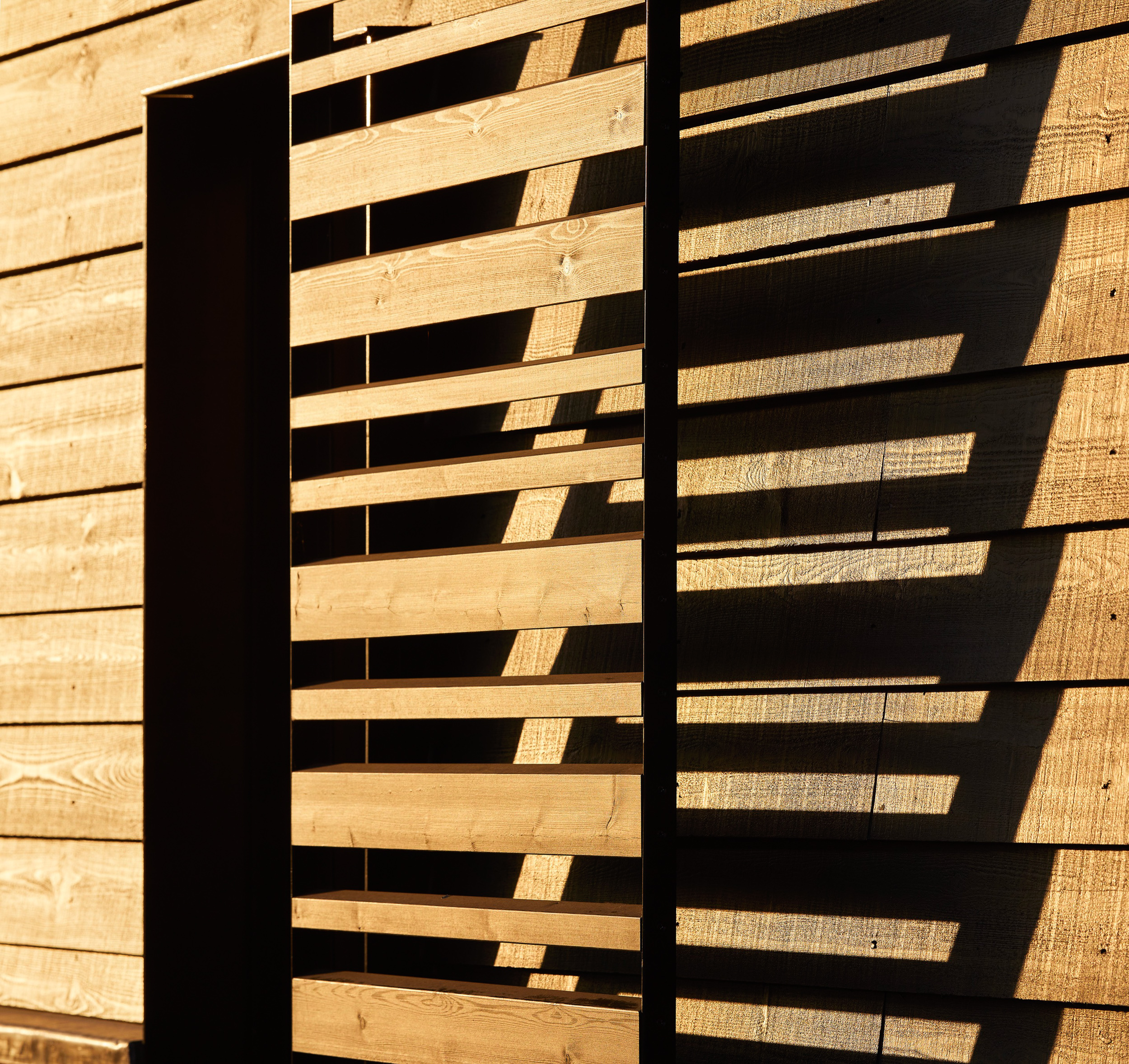 Horizontal timber shutters with strong shadows | cdc studio cambridge architects