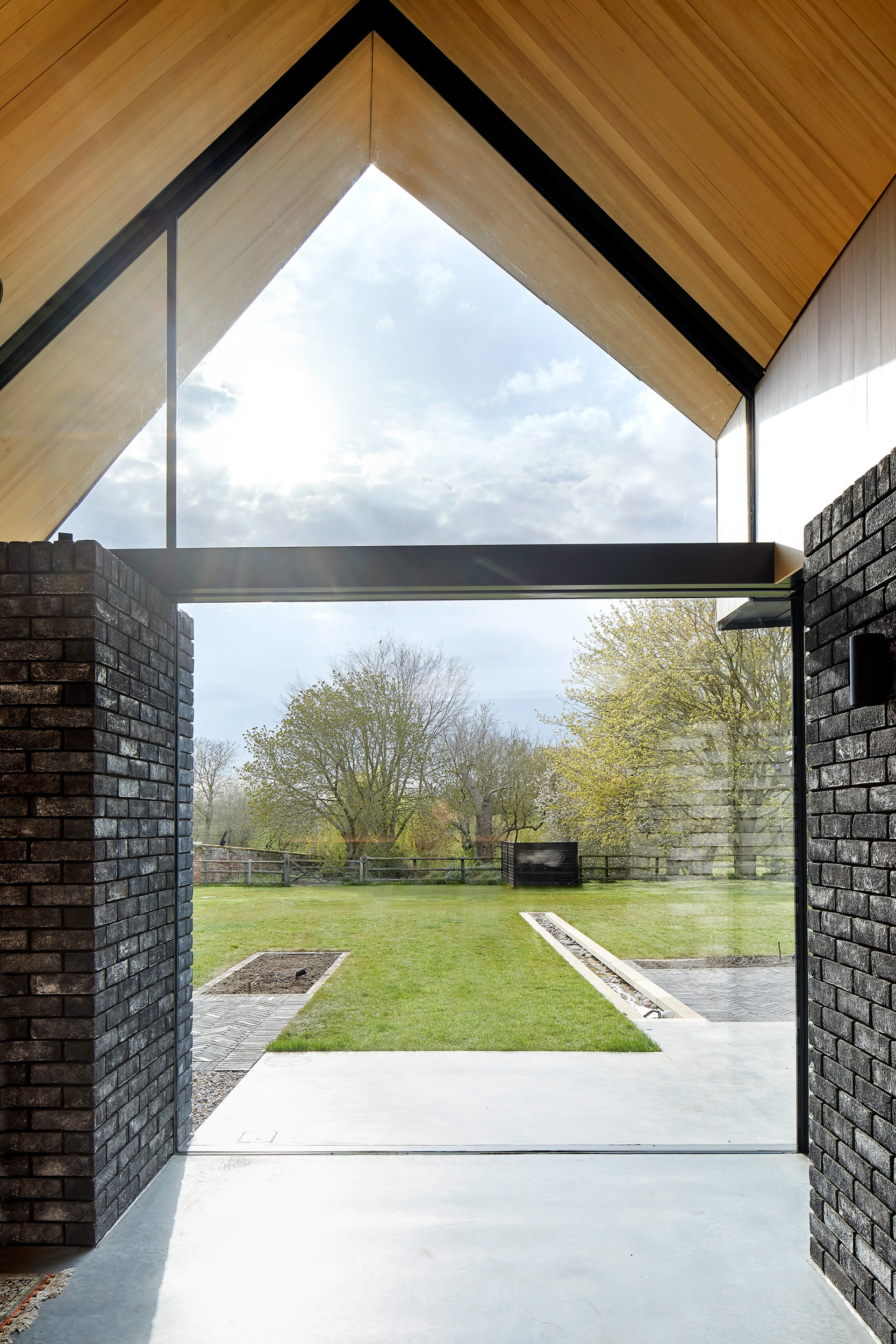 Large glass window looking to Cambridgeshire landscape | cdc studio cambridge architects